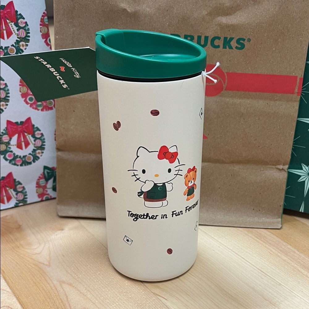 Starbucks Cream Tumbler with Green Lid and Hello Kitty Design